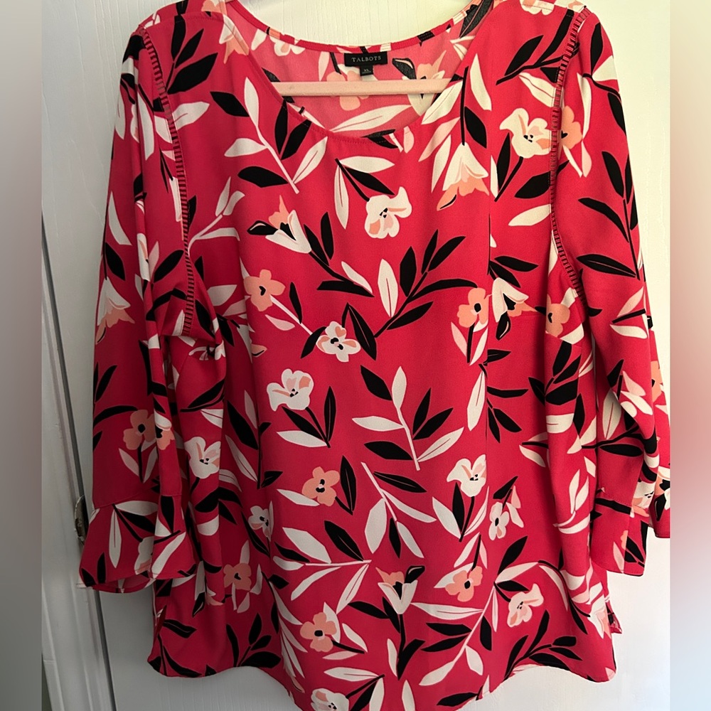 Really pretty red top with lantern sleeves floral accent
